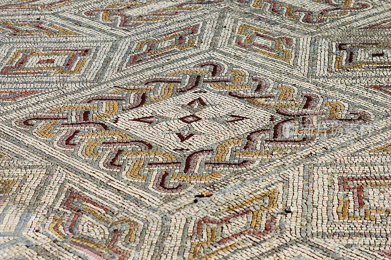 Mosaic fragment with braid and lily flowers in the Roman villa of Conímbriga Portugal.
